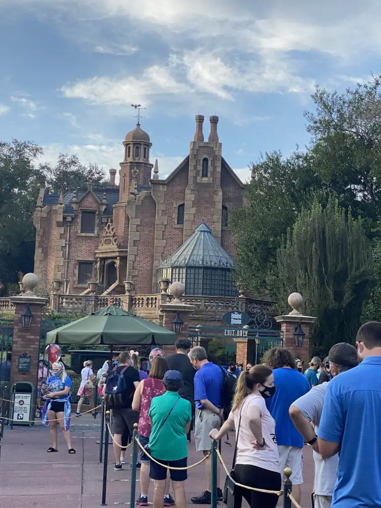 disney world crowds in front of haunted mansion