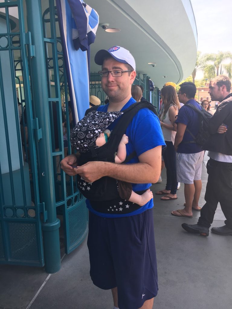 dad wearing baby at disney world