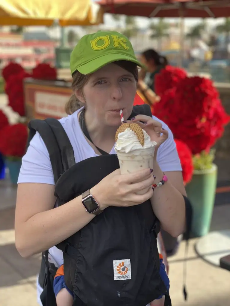 drink a smoothie and wearing baby at disney world