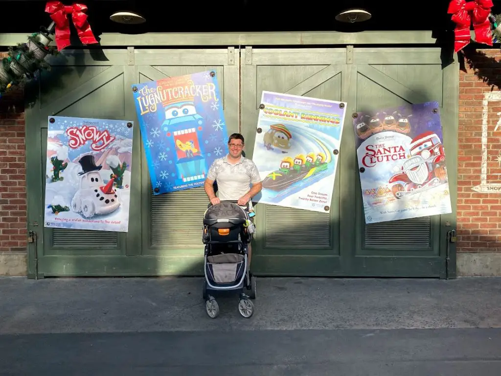 man in front of Christmas decorations at Disneyland